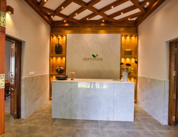 Ayurveda-themed lobby at Softouch Ayurveda Village in Kerala, featuring serene ambiance and traditional decor.