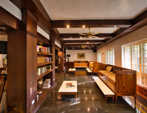 Cozy corner of the library at Softouch Ayurveda Village in Kerala. Comfortable seating, shelves filled with books, and a serene ambiance invite you to relax, read, and unwind in this tranquil space. Experience the tranquility of the library at Softouch Ayurveda Village Kerala.