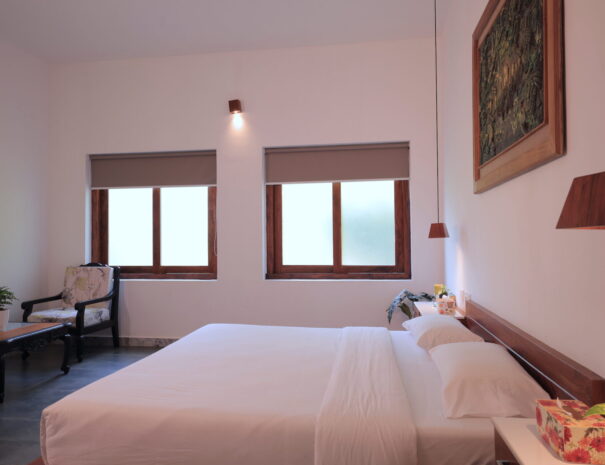 Ayur Villa - Bed room with desk at Softouch Ayurveda Village & Resort Kerala